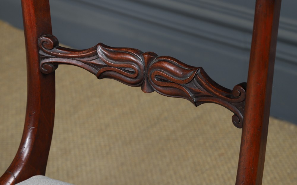 A set of six mahogany Regency dining chairs featuring carved back rails, turned front legs, and light-coloured upholstered seats. View XII