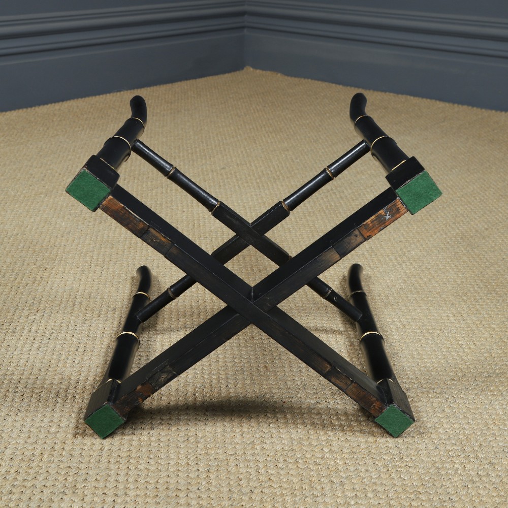 An ebonised Victorian papier-mache tray table featuring gilt Chinoiserie decoration and a lion motif, resting on a faux-bamboo base. View XII