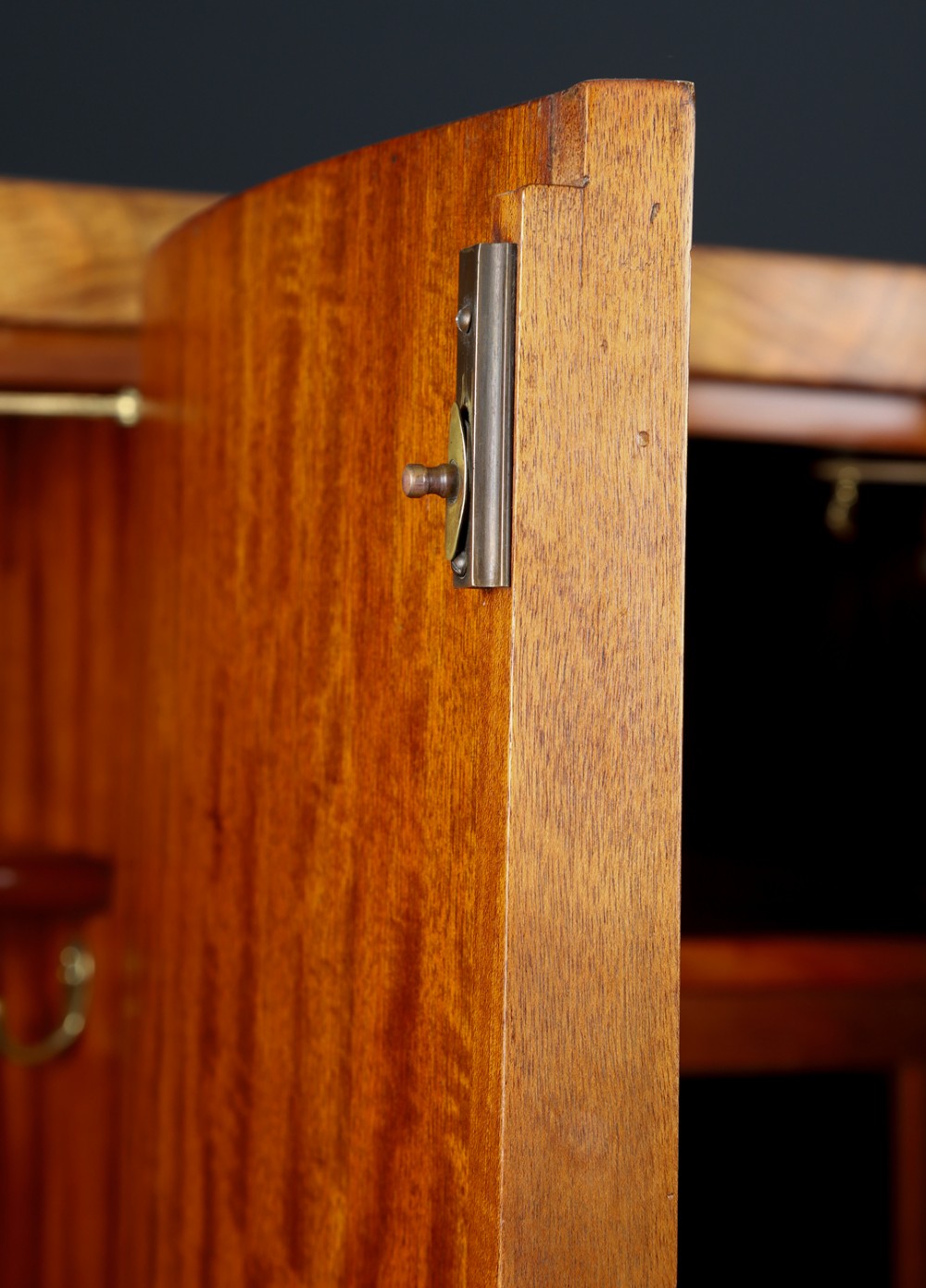 An English Art Deco triple-door wardrobe crafted from figured burr walnut with curved sides and vertical handles. View XI