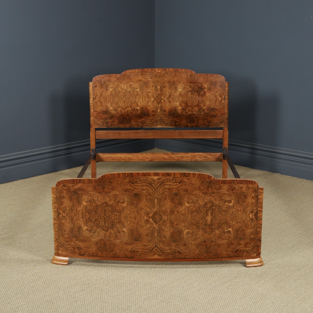An Art Deco double bed frame featuring a curved cloud-shaped headboard and footboard crafted from figured burr walnut veneer. View V
