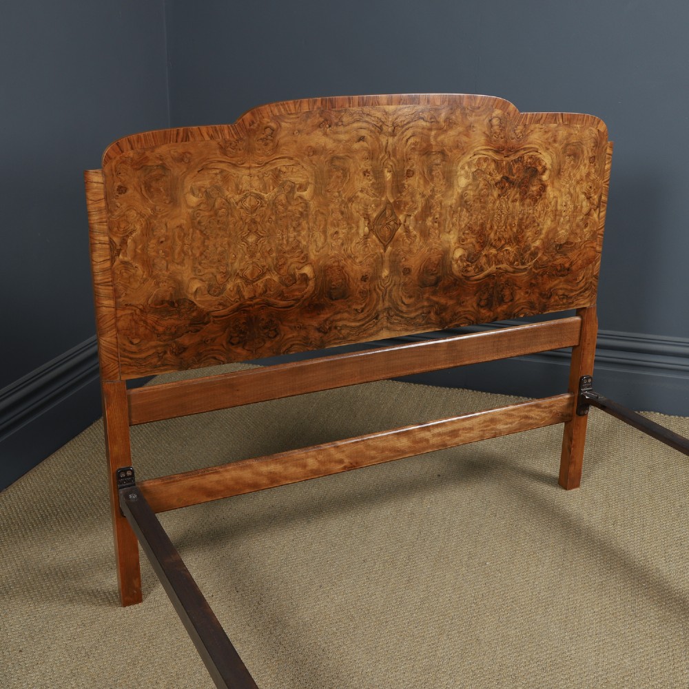 An Art Deco double bed frame featuring a curved cloud-shaped headboard and footboard crafted from figured burr walnut veneer. View VI