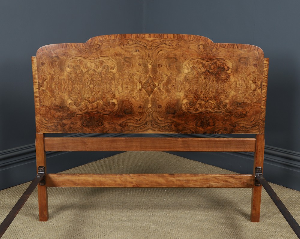 An Art Deco double bed frame featuring a curved cloud-shaped headboard and footboard crafted from figured burr walnut veneer. View VII