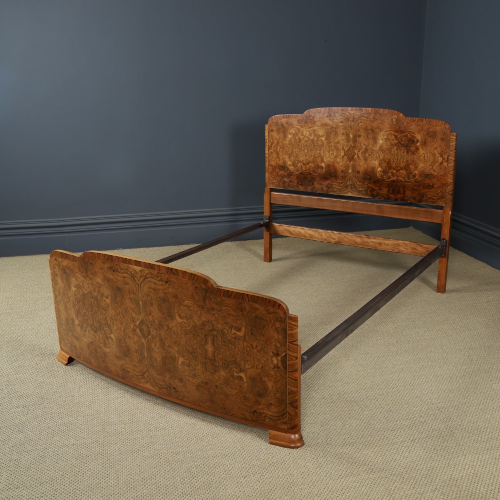 An Art Deco double bed frame featuring a curved cloud-shaped headboard and footboard crafted from figured burr walnut veneer. View VIII