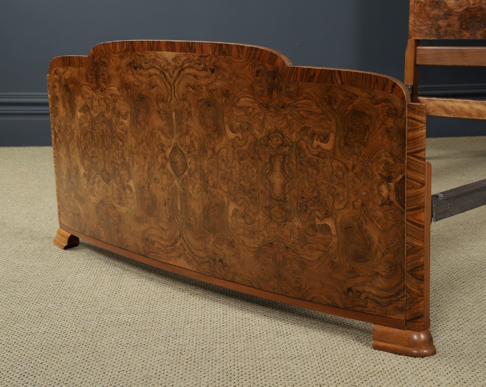An Art Deco double bed frame featuring a curved cloud-shaped headboard and footboard crafted from figured burr walnut veneer. View IX