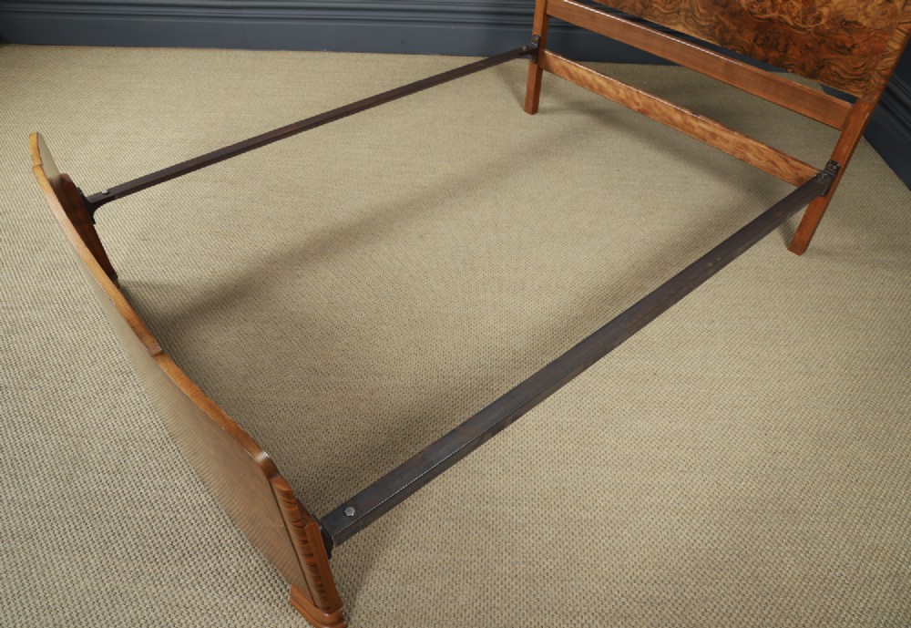 An Art Deco double bed frame featuring a curved cloud-shaped headboard and footboard crafted from figured burr walnut veneer. View XI