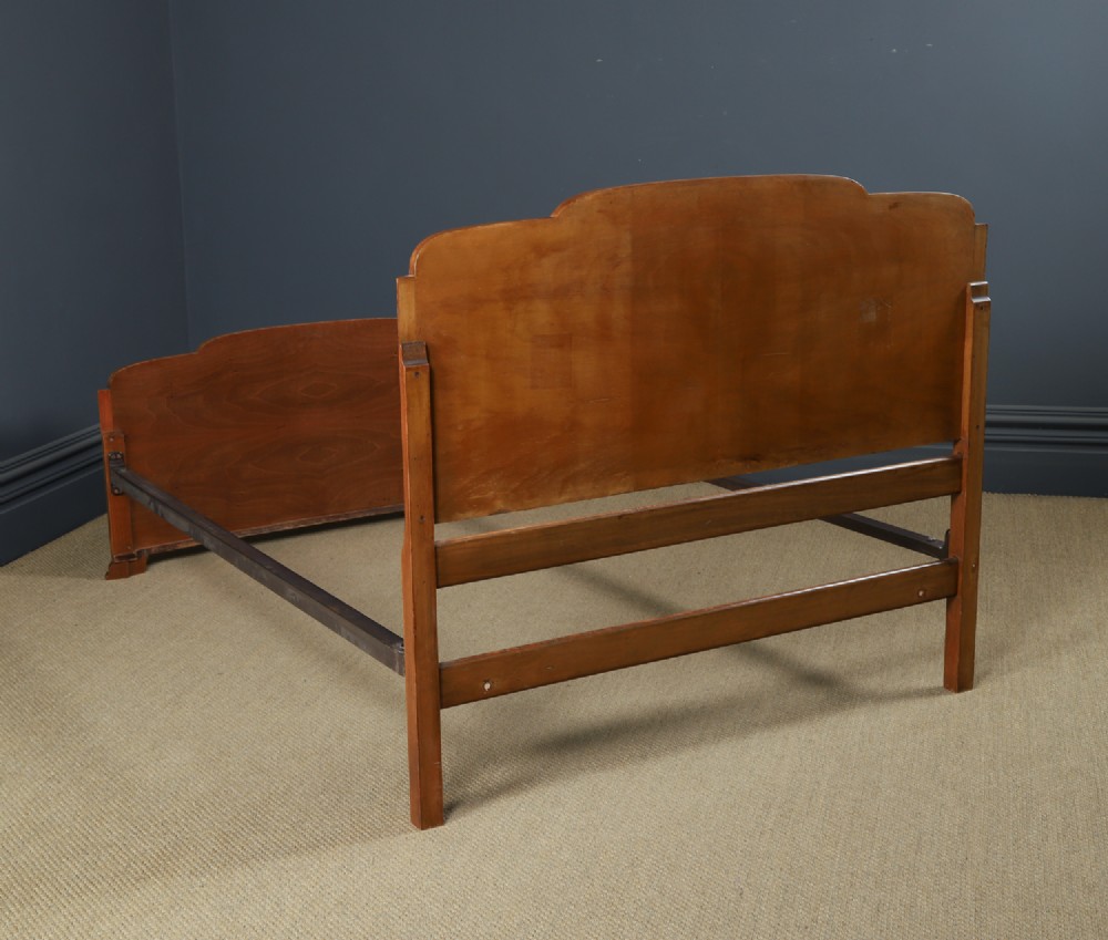 An Art Deco double bed frame featuring a curved cloud-shaped headboard and footboard crafted from figured burr walnut veneer. View XIII