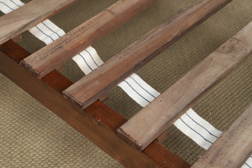 An Edwardian mahogany single four poster bed with turned posts, an arched canopy structure, and neutral drapery. View XI