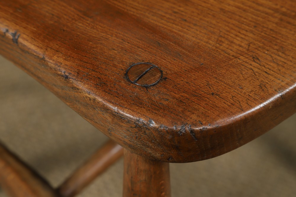 Set of ten warm brown ash and elm Windsor dining chairs with hoop and stick backrests. View V