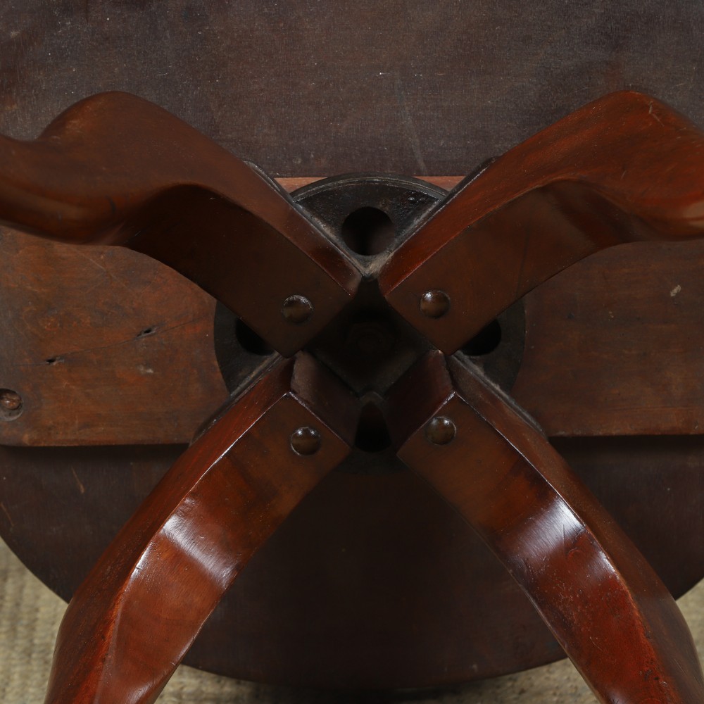 Victorian mahogany revolving desk armchair featuring a curved crest rail, pierced splat back, contoured wooden seat, and four legs with castors. View XIII