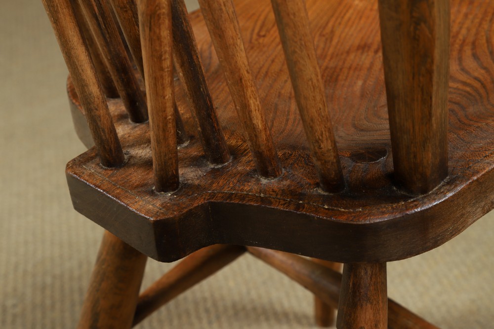 A set of eight antique Edwardian ash and elm Windsor dining chairs with arched hoop stick backs, shaped seats, and turned legs. View XIV