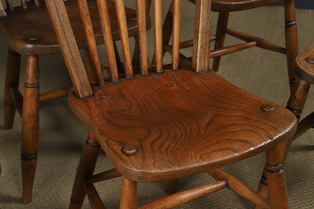 A set of six Edwardian Windsor dining chairs crafted from ash and elm wood, featuring hoop-and-stick backs, shaped seats, turned legs, and H-stretchers. View III
