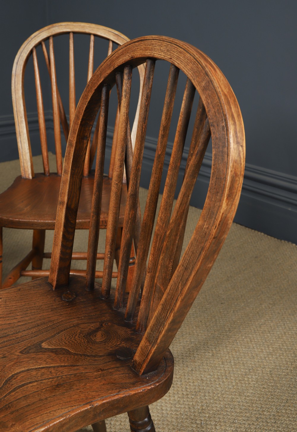A set of six Edwardian Windsor dining chairs crafted from ash and elm wood, featuring hoop-and-stick backs, shaped seats, turned legs, and H-stretchers. View VII