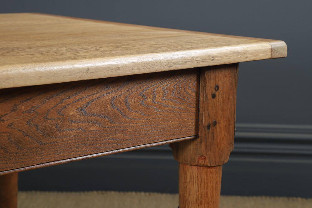 A long Victorian 19th-century refectory dining table with a light pitch pine top and dark oak frame on turned legs. View III