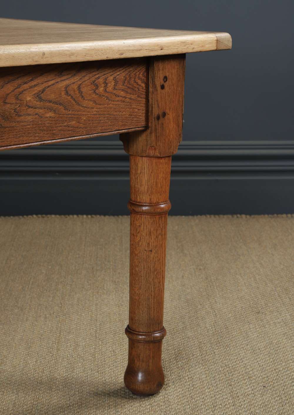 A long Victorian 19th-century refectory dining table with a light pitch pine top and dark oak frame on turned legs. View IV