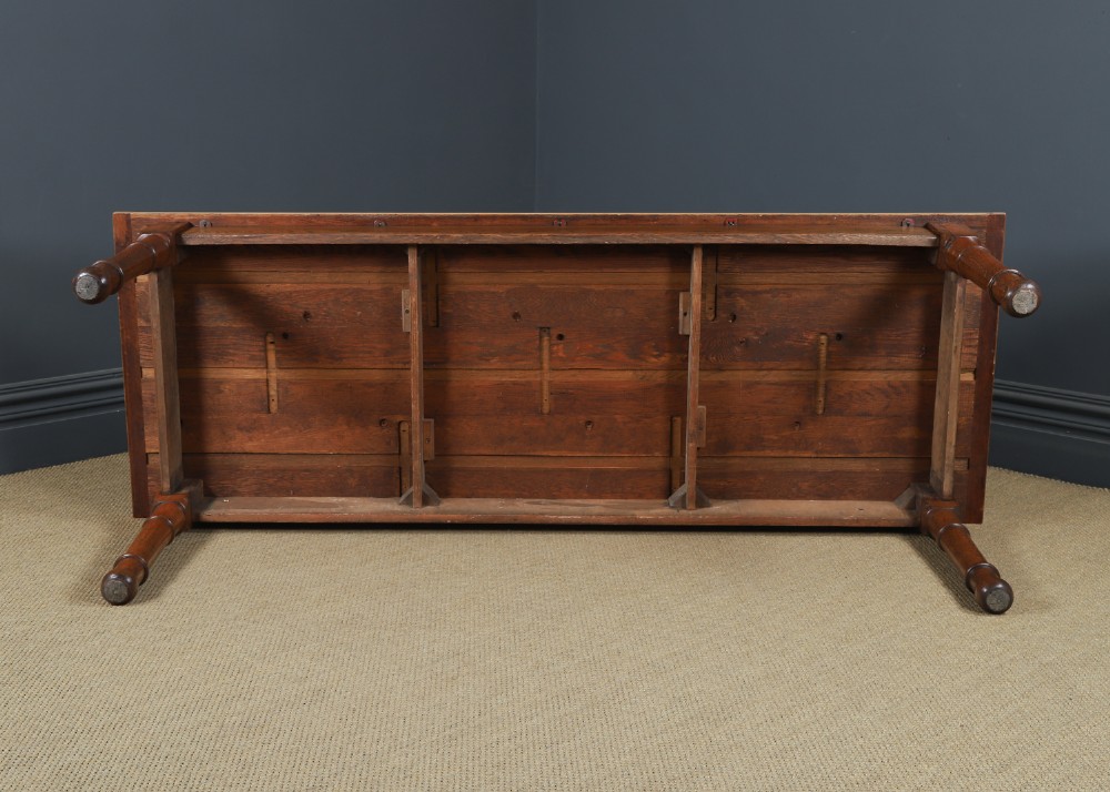 A long Victorian 19th-century refectory dining table with a light pitch pine top and dark oak frame on turned legs. View XII