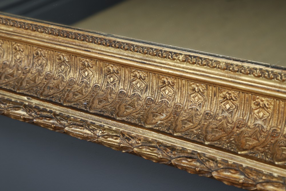 A rectangular Victorian gilt wall mirror featuring a moulded frame with classical leaf and beaded details. View IX