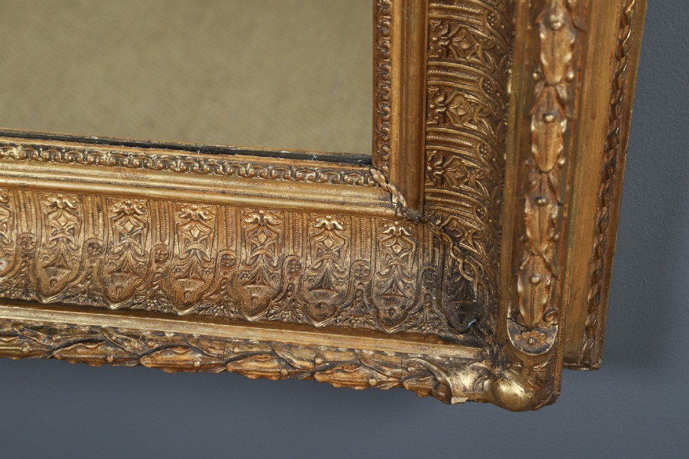 A rectangular Victorian gilt wall mirror featuring a moulded frame with classical leaf and beaded details. View XI