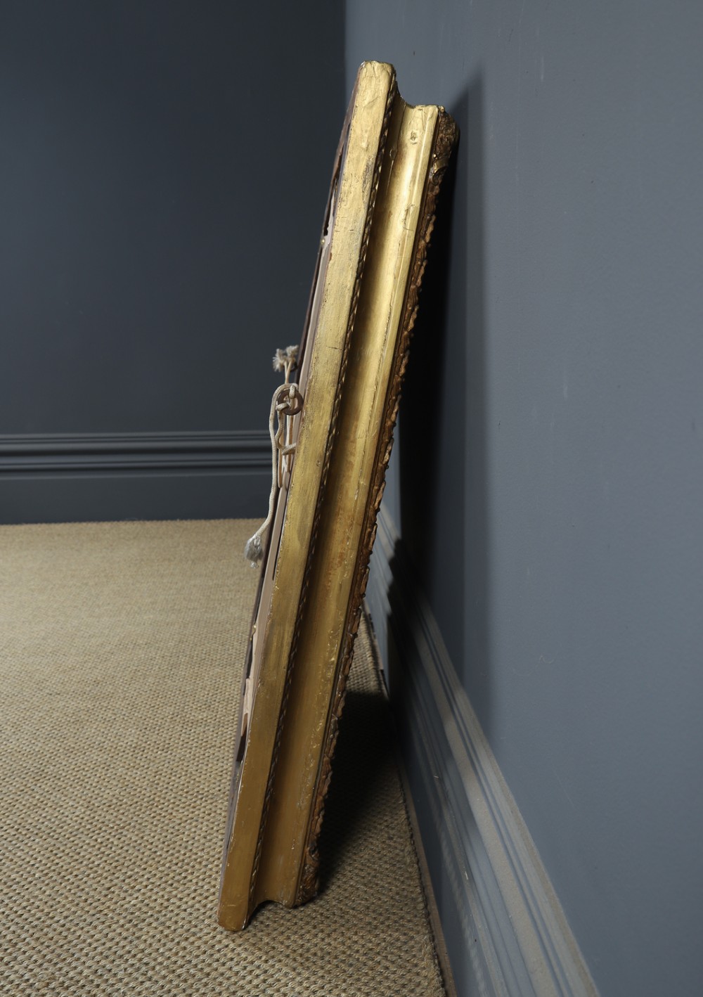 A rectangular Victorian gilt wall mirror featuring a moulded frame with classical leaf and beaded details. View XII