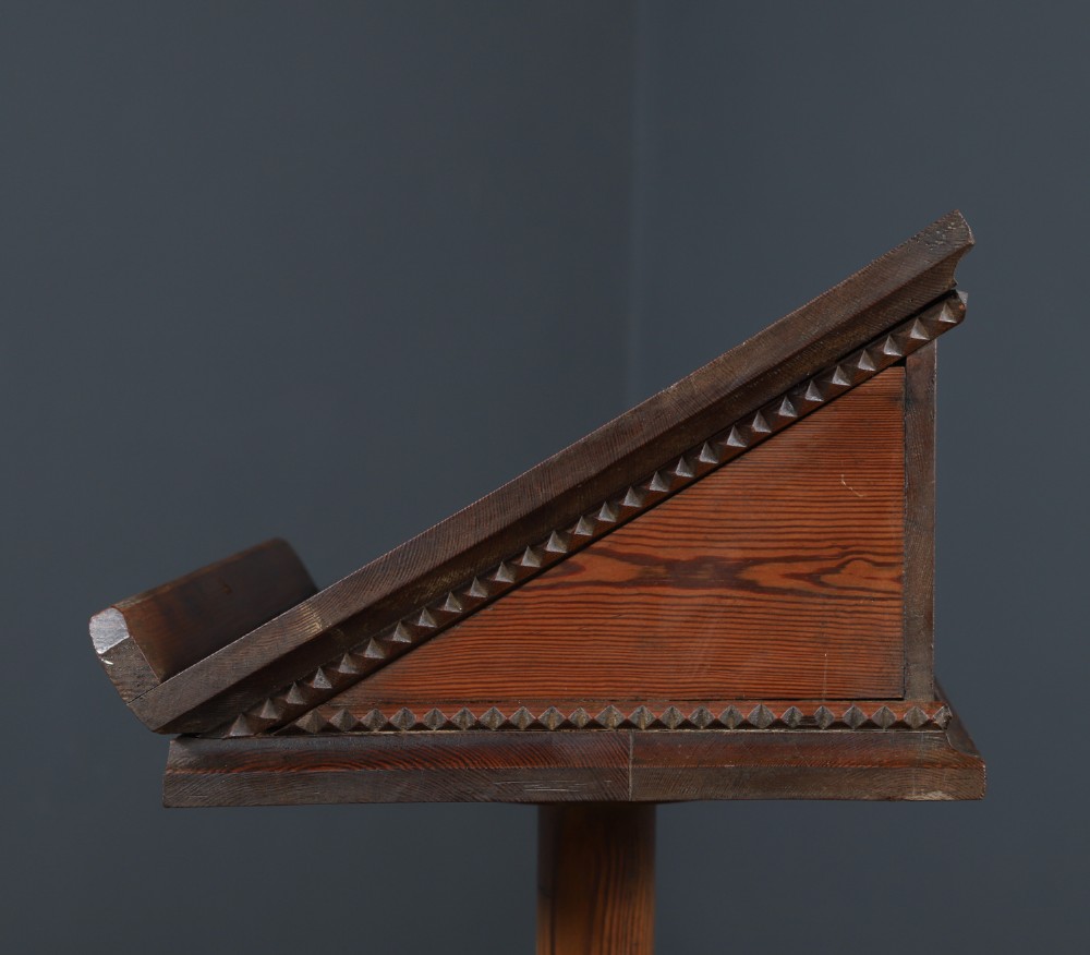 An antique Victorian pitch pine lectern featuring a slanted book rest, turned central column, and a Gothic-style pedestal base. View XI