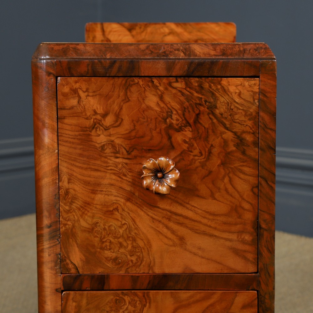 A pair of narrow Art Deco burr walnut bedside cabinets featuring two drawers with carved circular handles and a low back ledge. View VIII