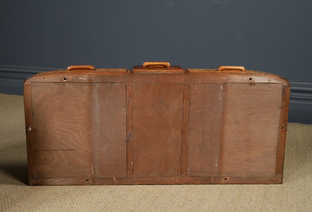 An Art Deco walnut and burr elm pedestal desk featuring stepped side pedestals, bookmatched wood veneers, wooden handles, and a fitted glass top. View XV