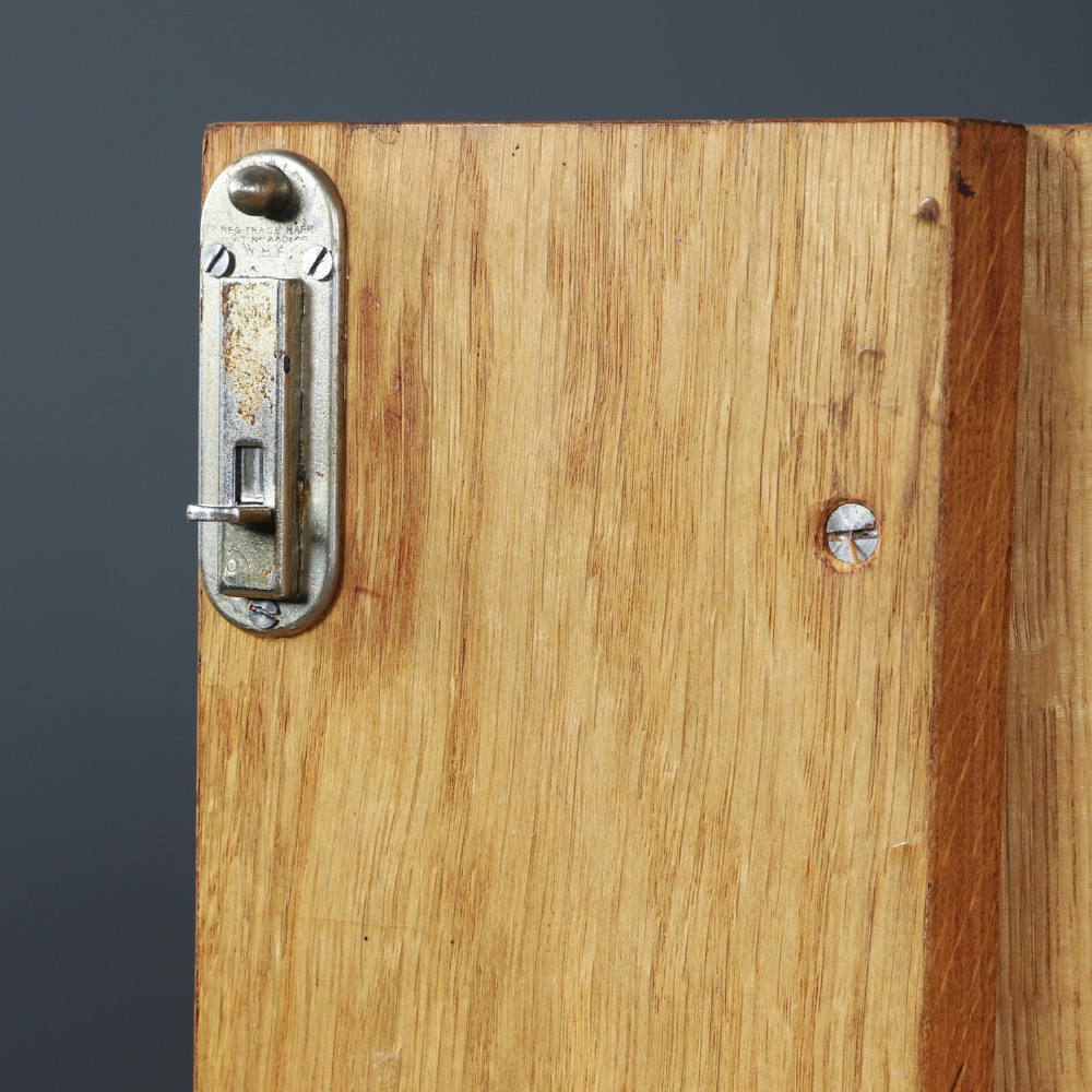 An Art Deco walnut two door wardrobe featuring a bow front design, carved wood handles, and figured timber grain. View XIII