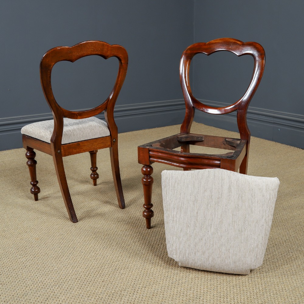 A set of six Victorian mahogany dining chairs featuring open balloon-shaped backs, turned front legs, and neutral upholstered seats. View XII