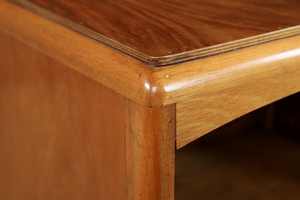 A pair of Art Deco walnut bedside tables with an upper open compartment and a lower cupboard featuring a round green handle. View V