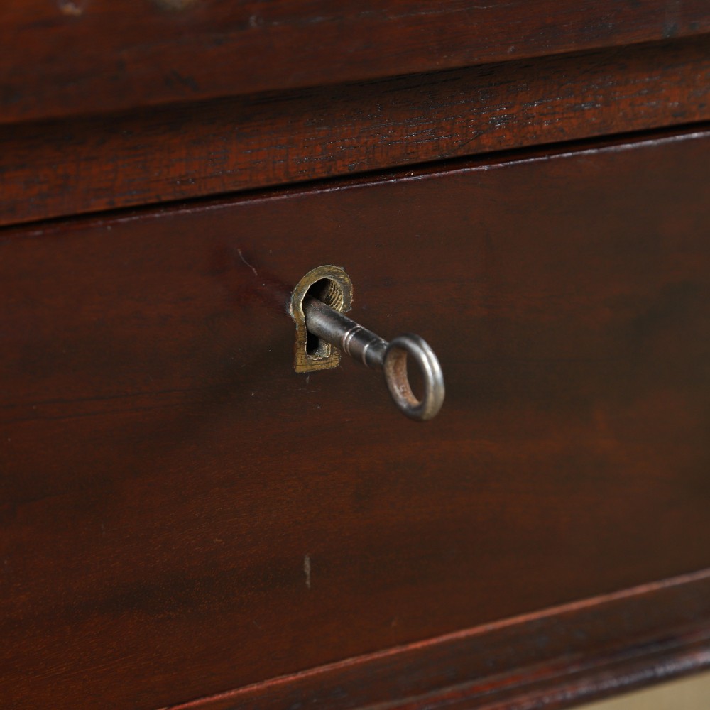 An antique rectangular dark mahogany low coffee table featuring a single drawer with two turned handles and a brass keyhole. View IV