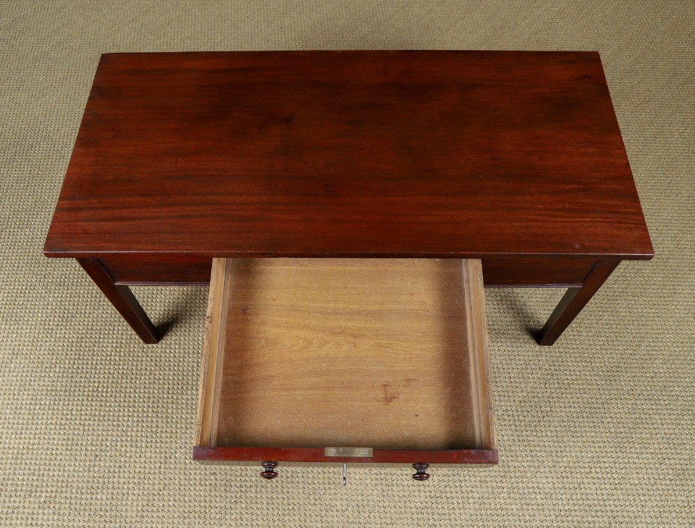 An antique rectangular dark mahogany low coffee table featuring a single drawer with two turned handles and a brass keyhole. View VI