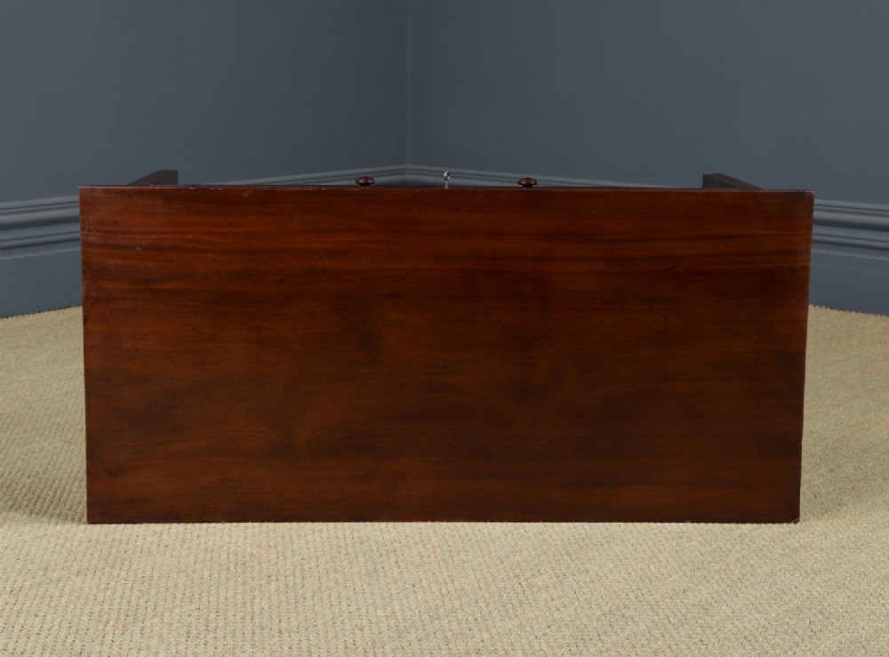 An antique rectangular dark mahogany low coffee table featuring a single drawer with two turned handles and a brass keyhole. View XIV