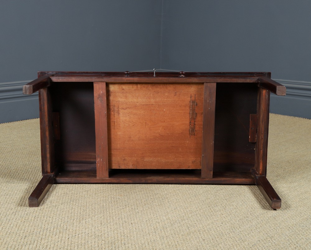 An antique rectangular dark mahogany low coffee table featuring a single drawer with two turned handles and a brass keyhole. View XV