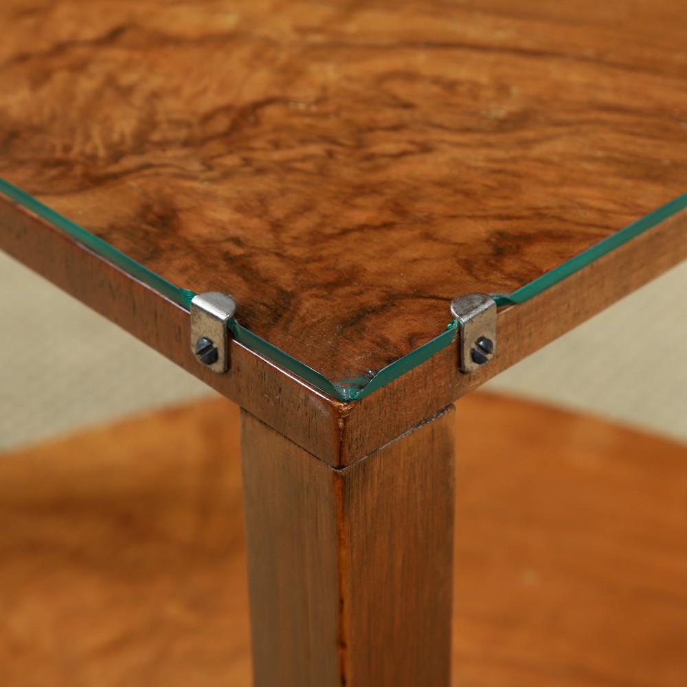 An Art Deco round walnut nest of five occasional tables featuring four quadrant side tables fitted beneath a central coffee table top. View IX