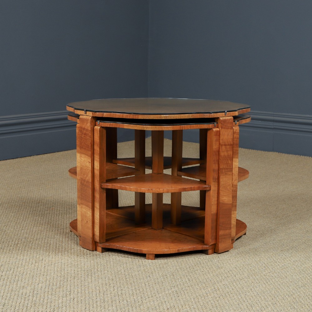 An Art Deco round walnut nest of five occasional tables featuring four quadrant side tables fitted beneath a central coffee table top. View XIII