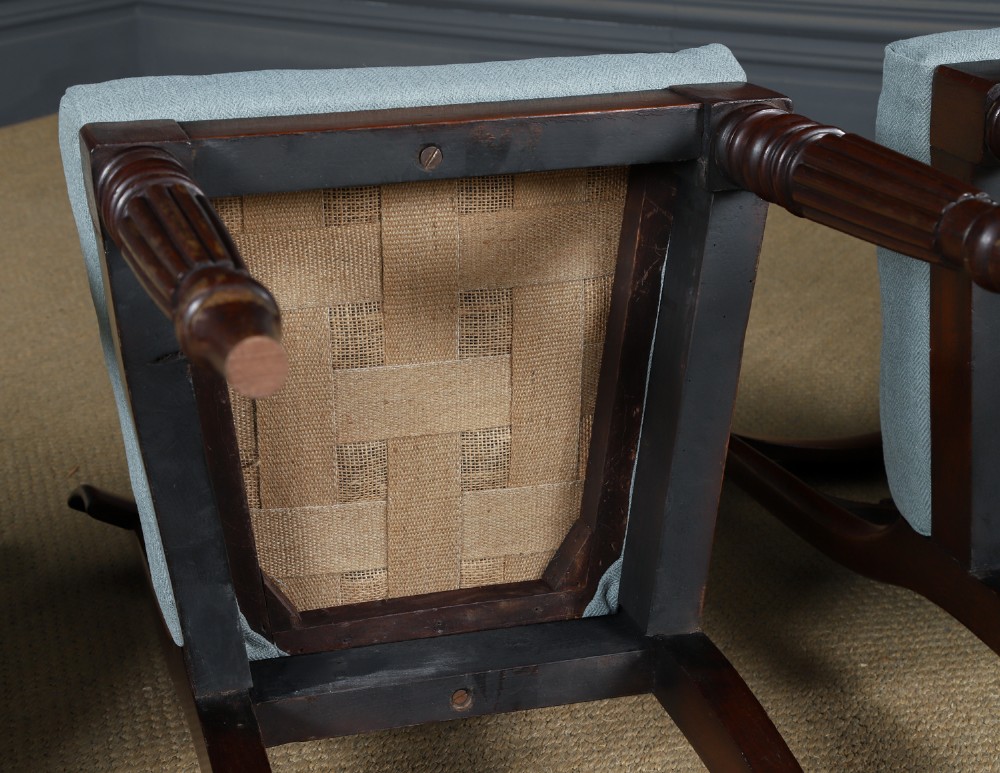 A set of six antique mahogany dining chairs featuring curved top rails, carved horizontal splats, fluted turned front legs, and light blue upholstered seats. View XIV