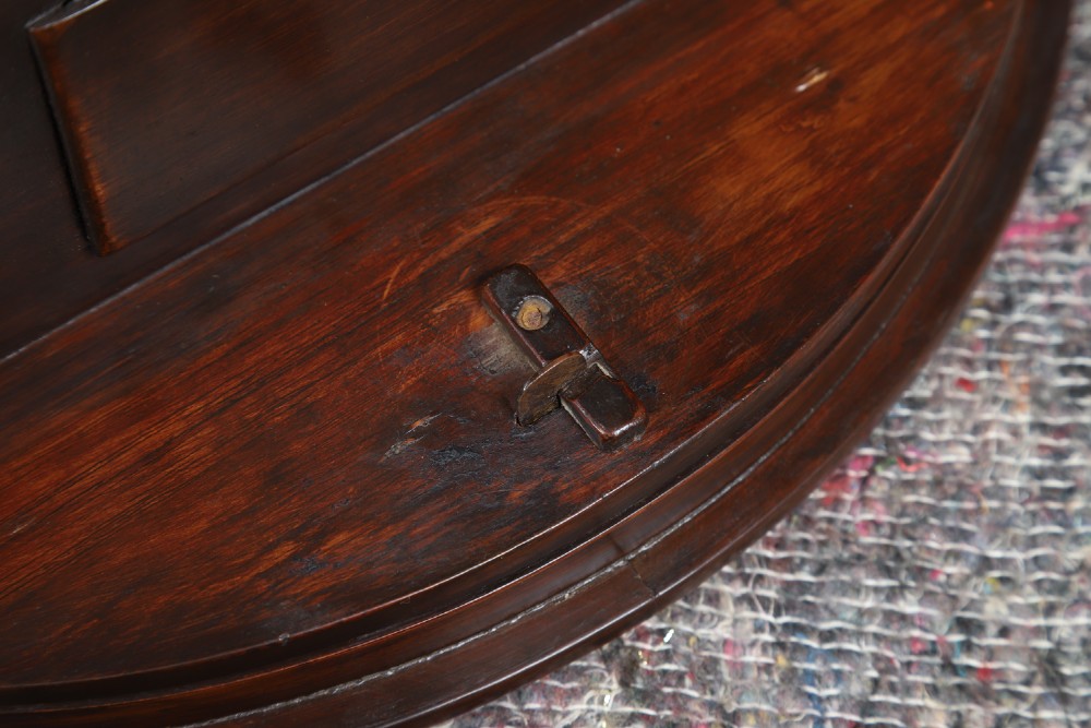 A circular mahogany wall clock with a cream dial, black Arabic numerals, black metal hands, two brass winding holes, and the Enfield maker name printed in the centre. View XV