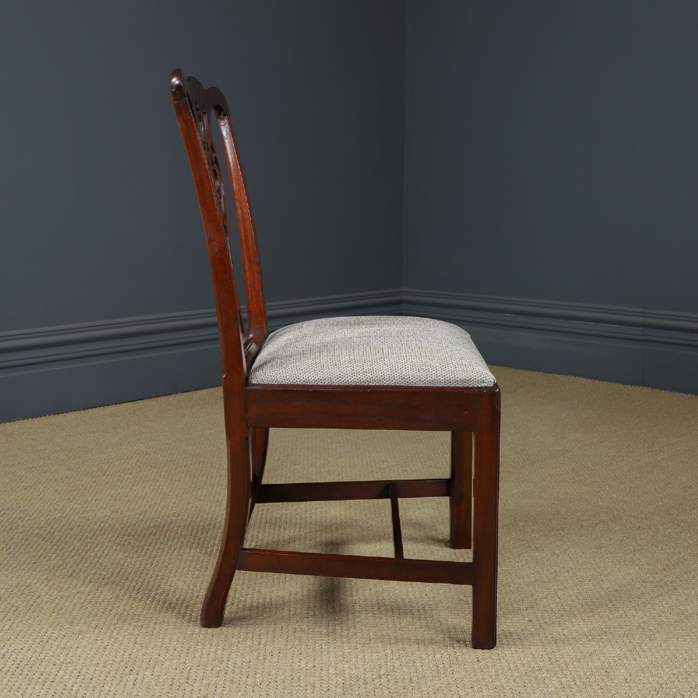 A Georgian mahogany side chair with a pierced carved back splat, square legs connected by stretchers, and a neutral textured seat upholstery. View VI