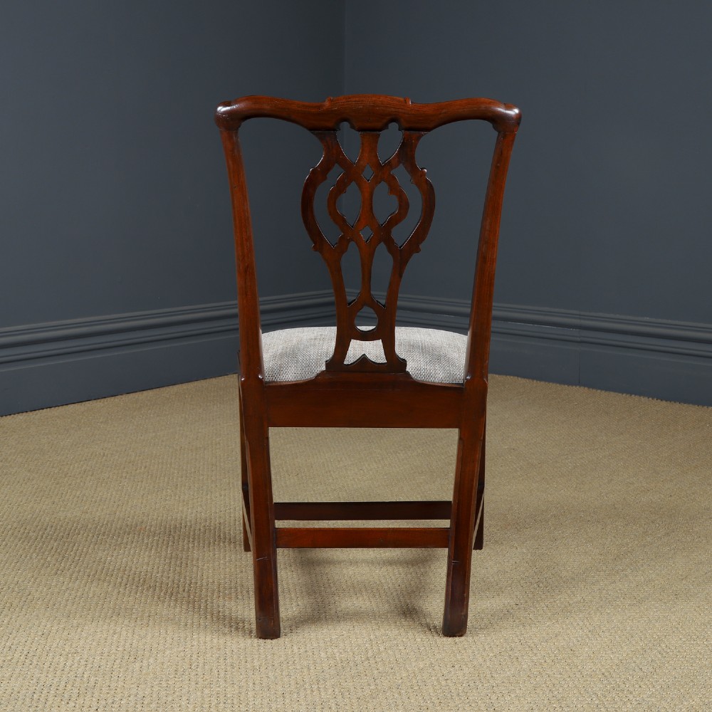 A Georgian mahogany side chair with a pierced carved back splat, square legs connected by stretchers, and a neutral textured seat upholstery. View VIII