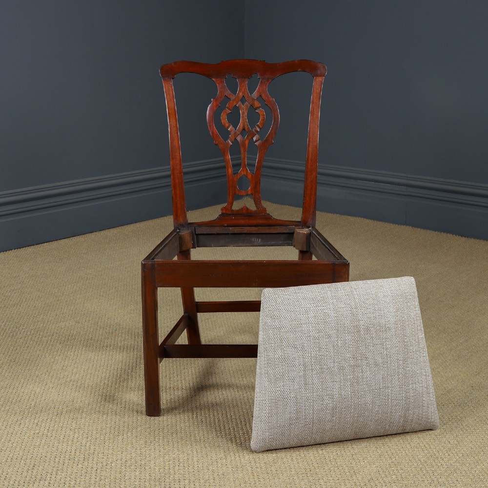 A Georgian mahogany side chair with a pierced carved back splat, square legs connected by stretchers, and a neutral textured seat upholstery. View XII