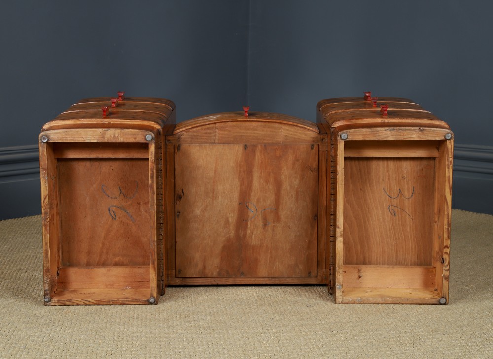 An Art Deco figured walnut dressing table featuring twin pedestal drawers, a central curved drawer, red handles, and a three-panel upright mirror. View XV