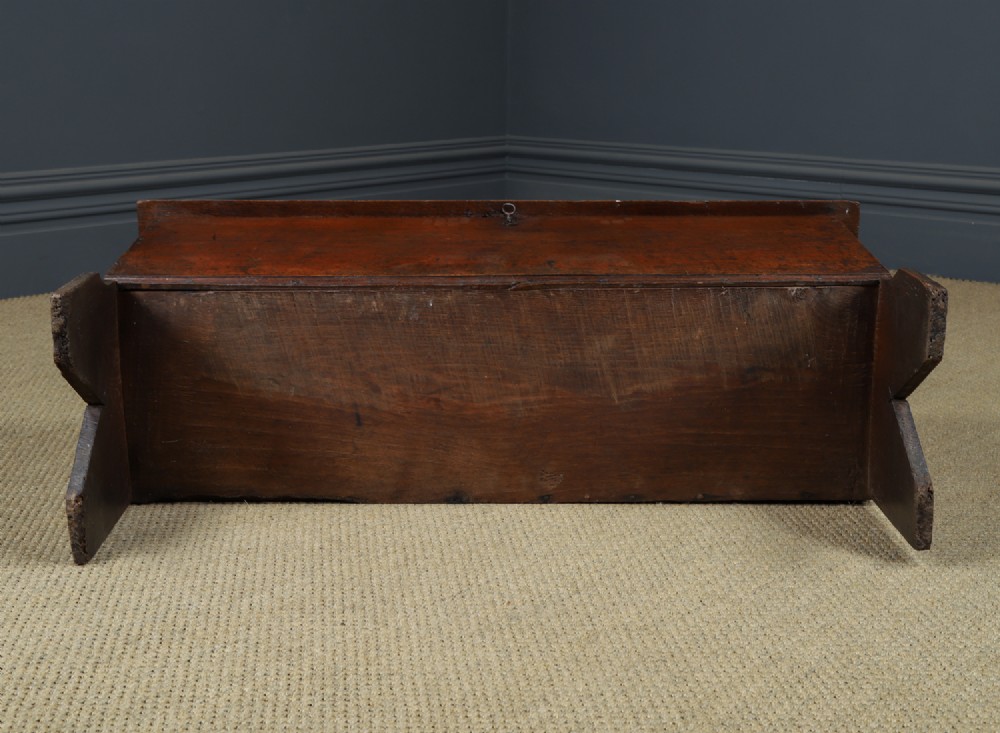 A rectangular dark brown oak six-plank coffer featuring V-cut side legs and iron keyhole escutcheon detail. View XV