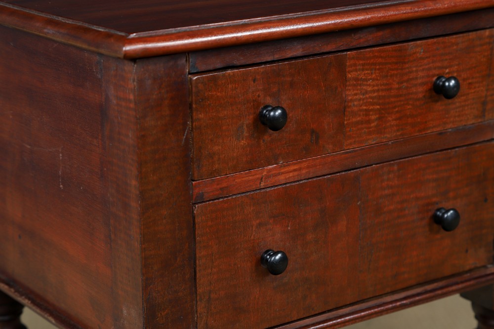 A pair of tall Victorian mahogany bedside tables featuring two small drawers with black knobs, turned legs, and a concave lower shelf. View III