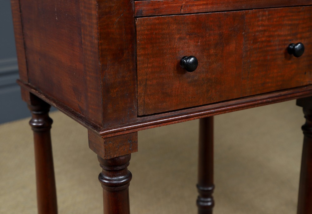 A pair of tall Victorian mahogany bedside tables featuring two small drawers with black knobs, turned legs, and a concave lower shelf. View IV