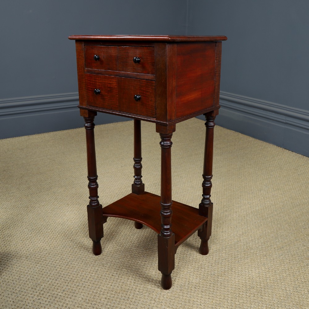 A pair of tall Victorian mahogany bedside tables featuring two small drawers with black knobs, turned legs, and a concave lower shelf. View VIII