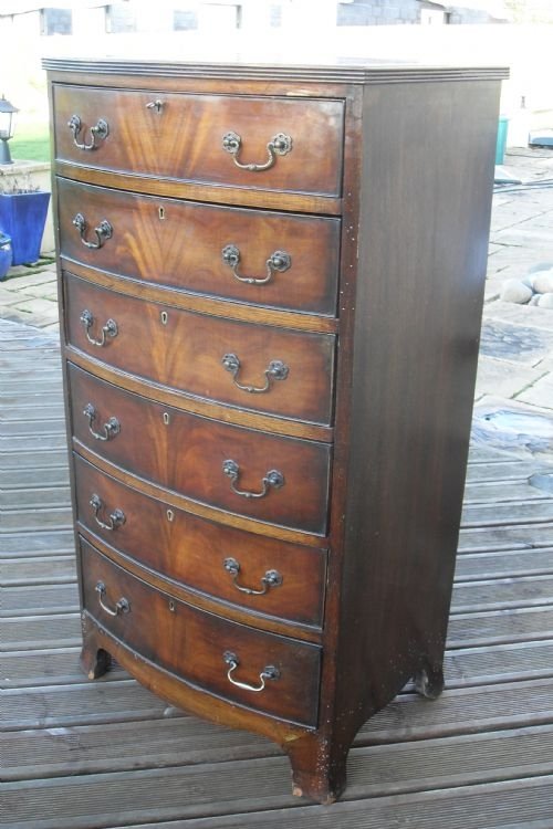 Walnut and Mahogany Bowfronted Chest of Drawers 
 
