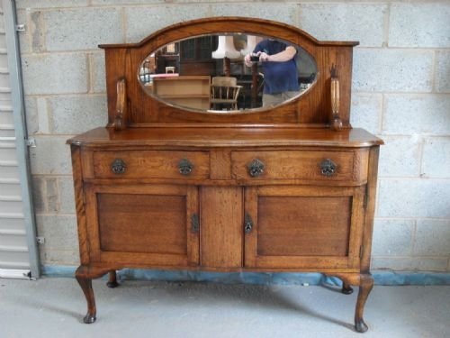 Golden Oak Serpentine Edged Sideboard with Mirrored Back