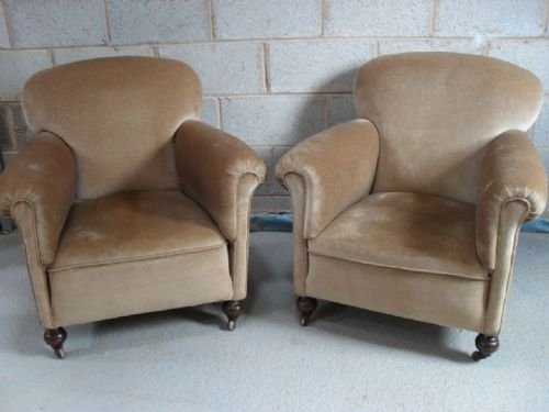 Pair of Beige Upholstered Easy Armchairs on Castors
