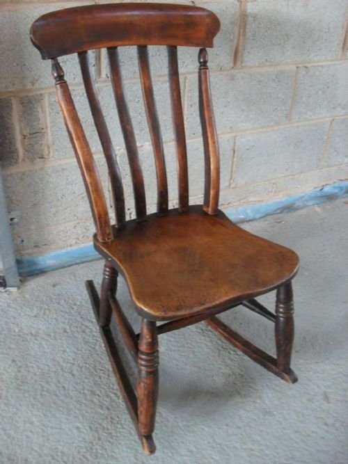 	
19th Century Elm and Beech Slat Back Rocking Chair