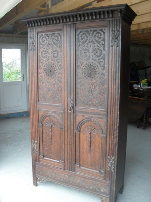 Carved Oak and Panelled Wardrobe