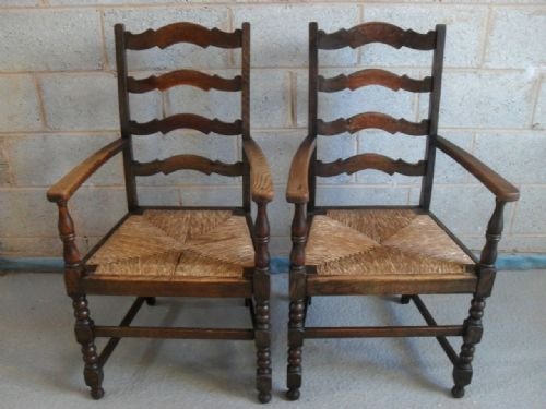 Pair of Oak and Rush Seated Ladder Back Carver Open Armchairs